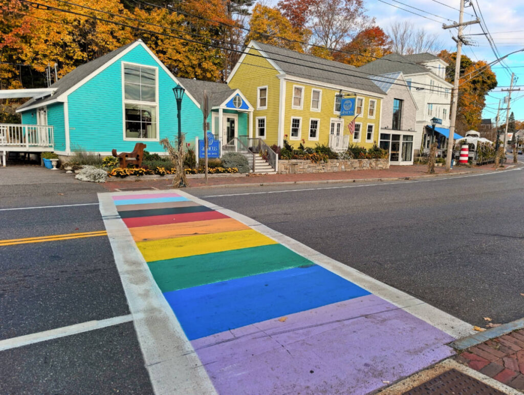 Rainbow Crosswalk with colorful buildings in Ogunquit Maine 1