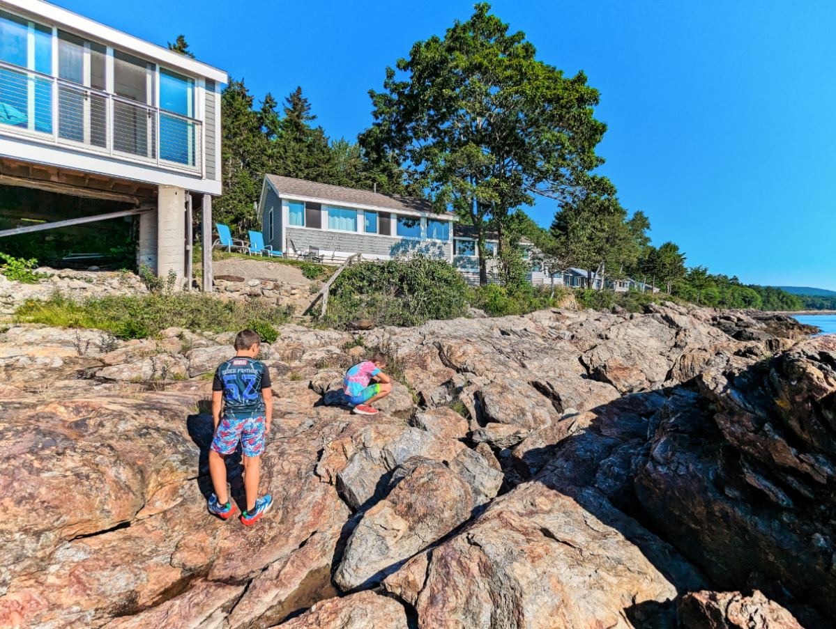 Taylor Family on rocks at cabins at Drift Oceanside Inn Camden Maine 1