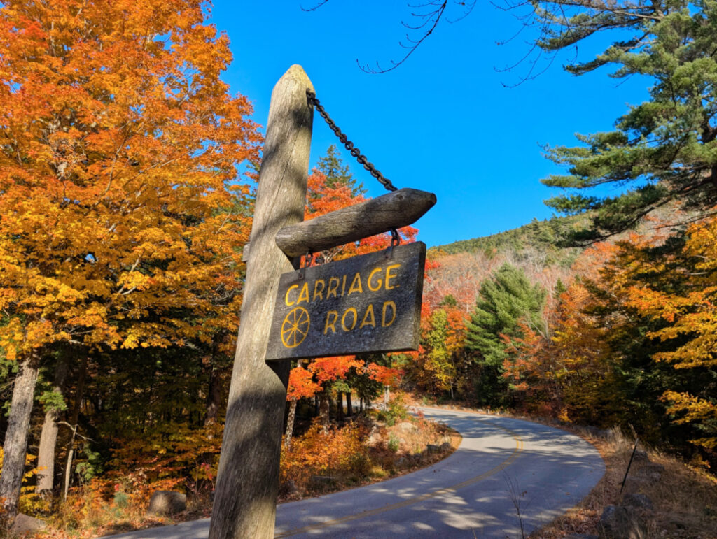 Fall Colors on the Carriage Roads with sign in Acadia National Park Maine 1