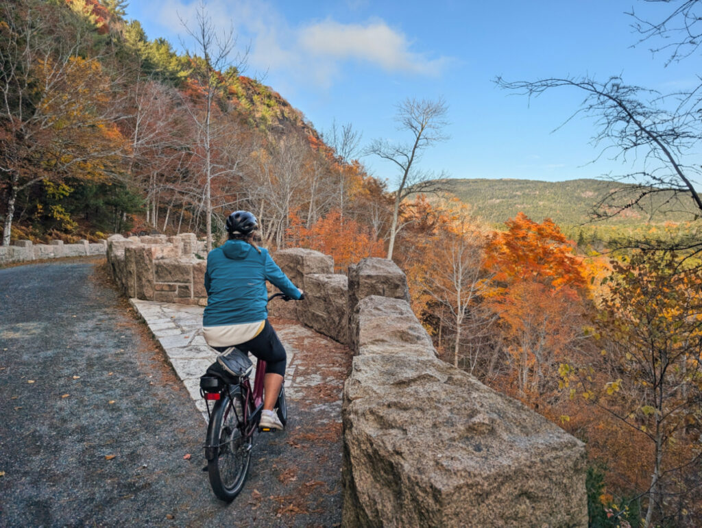 Kelly Riding Bikes on Carriage Roads with Arch bridge in Acadia National Park Maine 3