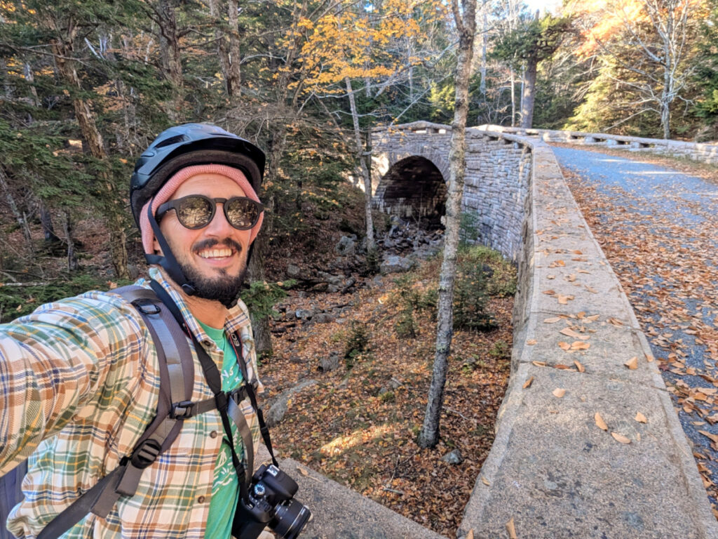 Rob Taylor Riding Bikes on Carriage Roads with Arch bridge in Acadia National Park Maine 1