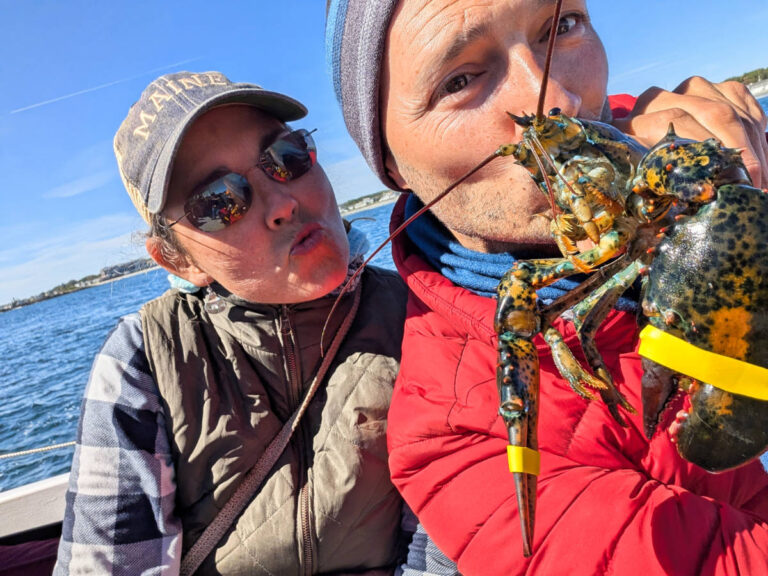 Kelly and Rob Taylor kissing Lobster on Rugosa Lobster Tour Kennebunkport Maine 1