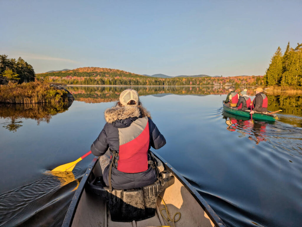 Kelly with Fall Colors on pond with Northeast Whitewater Canoe Moose Tour from Greenville Maine 2
