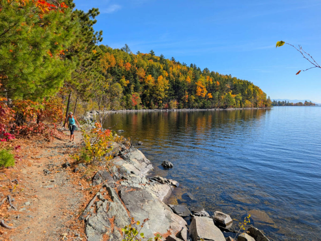 Kelly with Fall Colors on shore of Mount Kineo State Park Moosehead Lake Greenville Maine 2