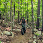 Kelly riding Mountain Bike on Katahdin Area Trails at New England Outdoor Center NEOC Millinocket Maine 2
