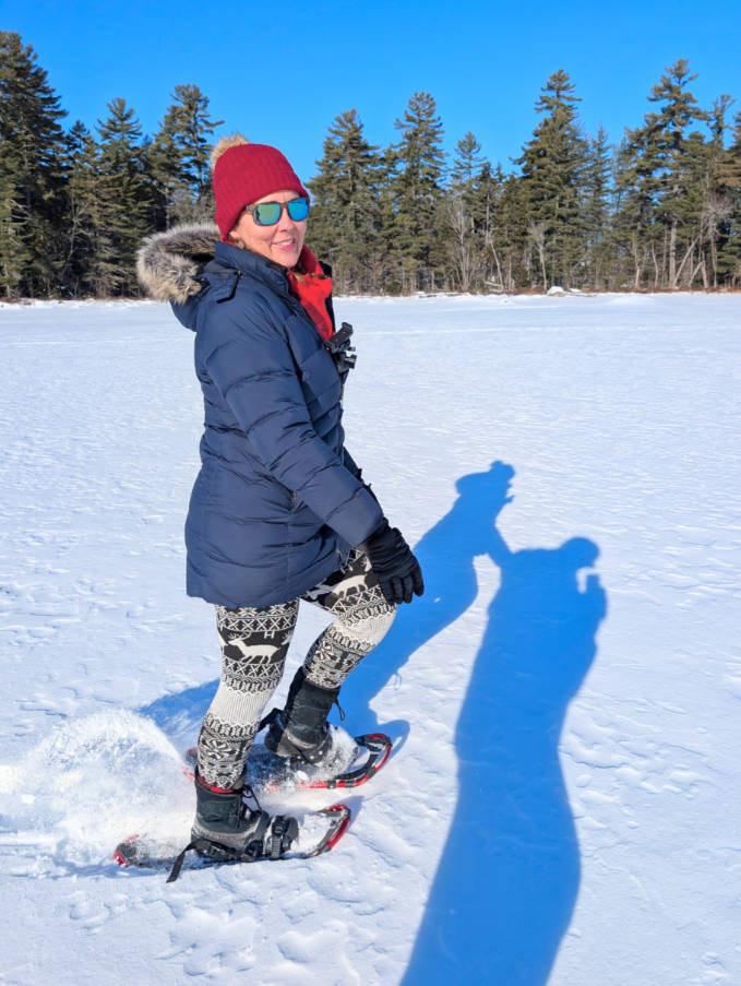 Kelly snowshoeing on frozen Millinocket Lake at NEOC New England Outdoor Center Maine 1