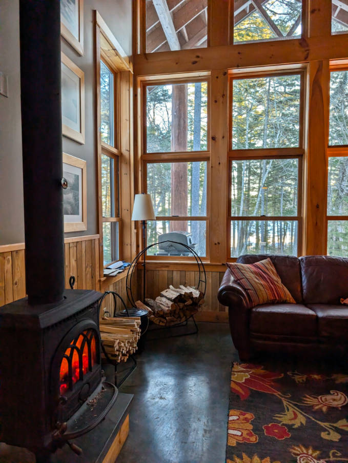Wood Stove in Living Room at Raven Cabin at NECO New England Outdoor Center Millinocket Maine 2